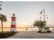 Scenic view of the lighthouse in Mount Dora, Florida with flags and palm trees at 601 W Old Us Highway 441 # 3-A, Mount Dora, FL 32757