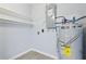 Utility area featuring a water heater and open shelving at 601 W Old Us Highway 441 # 3-A, Mount Dora, FL 32757