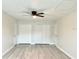 Bright and airy bedroom with wood-look floors and plenty of closet space at 6667 Blanton Ct, Orlando, FL 32809