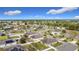 The aerial view captures an expansive community with many homes, streets, and trees at 673 Highland Meadows Ave, Davenport, FL 33837