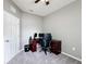 Neutral bedroom with a ceiling fan, computer desk and chair, and a large window at 673 Highland Meadows Ave, Davenport, FL 33837