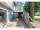 Fenced patio area with stone flooring and a sunshade in a residential area at 710 Saint Matthew Cir # 710, Altamonte Springs, FL 32714