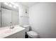 Clean bathroom features a white vanity with a white toilet and a mirror at 710 Saint Matthew Cir # 710, Altamonte Springs, FL 32714