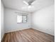 Bedroom showing wood-look floors and a ceiling fan at 710 Saint Matthew Cir # 710, Altamonte Springs, FL 32714