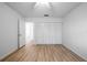 Empty bedroom with modern closet doors and wood look floors at 710 Saint Matthew Cir # 710, Altamonte Springs, FL 32714