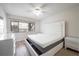 Bedroom featuring modern furniture, natural light, and wood look floors at 710 Saint Matthew Cir # 710, Altamonte Springs, FL 32714