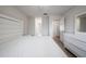 This bedroom showcases a white bed, dresser, and wood-look flooring at 710 Saint Matthew Cir # 710, Altamonte Springs, FL 32714