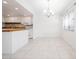 Bright eat-in kitchen featuring white cabinets and tiled flooring at 710 Saint Matthew Cir # 710, Altamonte Springs, FL 32714