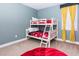 A bedroom with bunk beds and a red beanbag chair at 7463 Marker Ave, Kissimmee, FL 34747