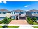 Charming two-story home with brick driveway, beautiful stone accents and well-manicured lawn at 7463 Marker Ave, Kissimmee, FL 34747