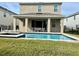 Backyard features a luxurious swimming pool and jacuzzi, perfect for relaxation and entertainment at 7479 Marker Ave, Kissimmee, FL 34747