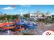 Water park with multiple slides, a play area, and a decorative resort building in the background at 7479 Marker Ave, Kissimmee, FL 34747