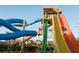 Thrill-seekers descending water slides, creating a fun experience with towering structures and colorful designs at 7479 Marker Ave, Kissimmee, FL 34747