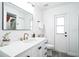 Bathroom featuring white cabinets, modern fixtures, and a framed mirror above a sink at 768 Park Valley Cir, Minneola, FL 34715