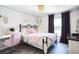 Bedroom featuring natural light, neutral wall color, wood-look floors and a decorative chandelier at 768 Park Valley Cir, Minneola, FL 34715