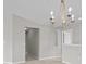 Airy dining area features a modern chandelier and smooth neutral walls providing an inviting atmosphere at 8312 Fontera Dr, Davenport, FL 33896