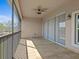 Covered and screened outdoor patio features sliding glass doors at 8312 Fontera Dr, Davenport, FL 33896