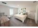 Cozy bedroom with plush carpet, decorative pillows, and abundant natural light at 945 Laurel View Way, Groveland, FL 34736