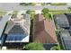 Aerial view of a house with a brown roof and well maintained landscaping in a suburban neighborhood at 1318 Horizon Creek Ct, Orlando, FL 32828