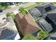 A bird's eye view of a home with a brown roof and small, brick patio in the backyard at 1318 Horizon Creek Ct, Orlando, FL 32828