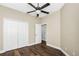 Cozy bedroom with wood floors, ceiling fan, and closet, perfect for relaxing at 1318 Horizon Creek Ct, Orlando, FL 32828