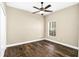 Bright bedroom with wood flooring, ceiling fan and window with natural light streaming in at 1318 Horizon Creek Ct, Orlando, FL 32828