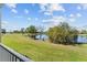 Breathtaking balcony view overlooking a lake, trees, and a sprawling green space on a clear day at 13929 Fairway Island Dr # 825, Orlando, FL 32837