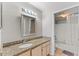 Bright bathroom with granite countertops and modern vanity at 13929 Fairway Island Dr # 825, Orlando, FL 32837