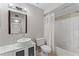 Bathroom featuring a new sink, modern vanity, a large mirror, and a tiled shower/tub at 13929 Fairway Island Dr # 825, Orlando, FL 32837