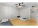 A simple bedroom with a ceiling fan and light fixture at 13929 Fairway Island Dr # 825, Orlando, FL 32837