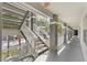 Exterior stairwell with modern white railings and gray painted structure offering neighborhood views at 13929 Fairway Island Dr # 825, Orlando, FL 32837