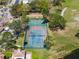 Aerial view of the community tennis and basketball court in a beautiful outdoor space at 13929 Fairway Island Dr # 825, Orlando, FL 32837