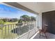 Relaxing balcony with serene view of the green lawn, perfect for enjoying morning coffee at 14013 Fairway Island Dr # 434, Orlando, FL 32837