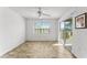 Light-filled bedroom with a sliding glass door to balcony and neutral decor, offering a relaxing atmosphere at 14013 Fairway Island Dr # 434, Orlando, FL 32837