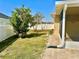 View of a backyard with grass and some small trees and bushes at 1556 Lemon Ave, Winter Haven, FL 33881