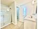 Modern bathroom featuring glass shower, single vanity, and modern fixtures at 1556 Lemon Ave, Winter Haven, FL 33881