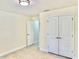 Bright bedroom featuring double closets, neutral walls, and an adjacent bathroom at 1556 Lemon Ave, Winter Haven, FL 33881