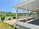 Sunlit screened-in patio with brick flooring, perfect for enjoying the outdoor scenery at 1556 Lemon Ave, Winter Haven, FL 33881