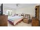Bright bedroom featuring tile flooring and a ceiling fan at 165 Coralwood Cir, Kissimmee, FL 34743