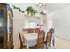Elegant dining room with decorative accents, tile flooring, and plenty of natural light at 165 Coralwood Cir, Kissimmee, FL 34743