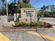 Signage at the entrance of Springwood Village Condominiums with lush landscaping and clear signage at 165 Springwood Circle # A, Longwood, FL 32750