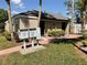 Exterior view of building with brick pathway and mailbox, showcasing a well-maintained community at 165 Springwood Circle # A, Longwood, FL 32750