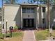 Exterior view of building with nicely landscaped entryway at 165 Springwood Circle # A, Longwood, FL 32750