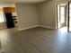 The view from the living room into the kitchen area, with stainless steel oven and refrigerator at 165 Springwood Circle # A, Longwood, FL 32750