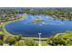 Breathtaking aerial view of a lakeside community with lush landscaping and private docks at 1659 Cherry Blossom Ter, Lake Mary, FL 32746