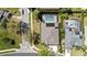 An aerial view of beautiful homes featuring private pools, solar panels and landscaped yards in a well-planned neighborhood at 1659 Cherry Blossom Ter, Lake Mary, FL 32746