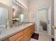 Bathroom featuring a vanity with lots of counter space and a door to the exterior at 1659 Cherry Blossom Ter, Lake Mary, FL 32746