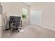 Bedroom features a workstation with dual monitors and a neutral color scheme at 1659 Cherry Blossom Ter, Lake Mary, FL 32746