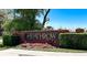 Welcoming brick sign for Heathrow, adorned with colorful flowers and green hedges at 1659 Cherry Blossom Ter, Lake Mary, FL 32746