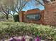 Elegant brick sign for Brookhaven Manor, set amidst manicured landscaping and mature trees at 1659 Cherry Blossom Ter, Lake Mary, FL 32746